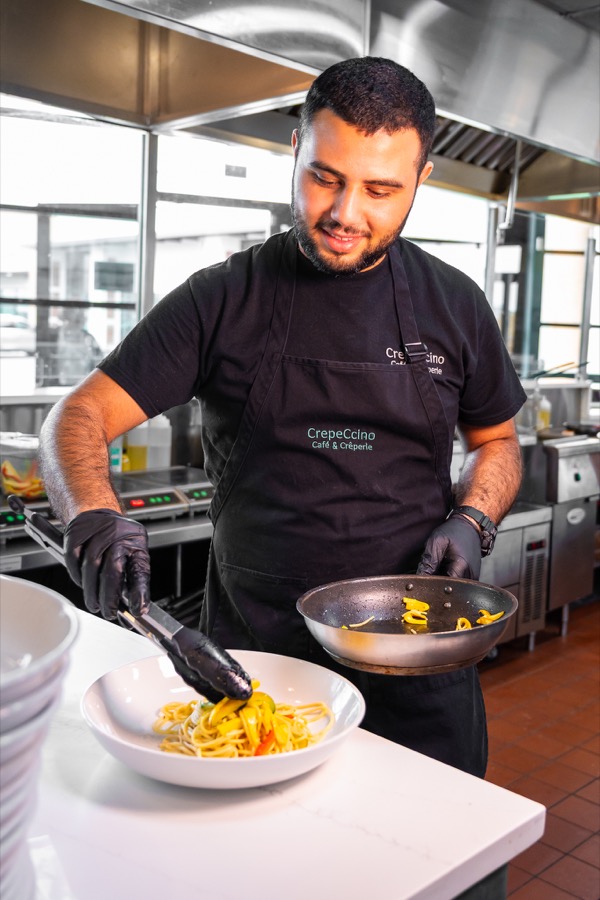 Crepeccino team preparing a savory cafe dish